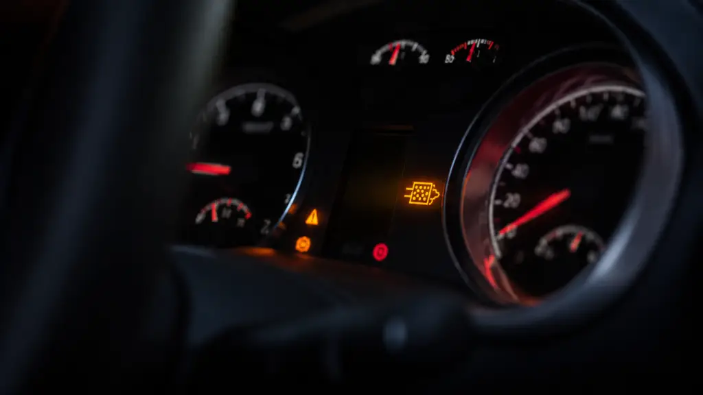 Illuminated DPF warning light on a diesel vehicle instrument cluster